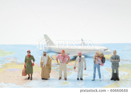 a mini Business Travelers Standing On A Map a mini Business Travelers Standing On A Map 60660688