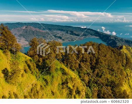 Aerial view of Batur volcano and lake with forest, Bali Indonesia Aerial view of Batur volcano and lake with forest, Bali Indonesia 60662320