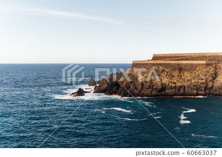 Breaking waves on the coast of Tenerife island, Canary islands, Atlantic ocean, Spain Breaking waves on the coast of Tenerife island, Canary islands, Atlantic ocean, Spain 60663037