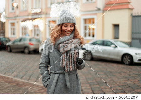 Happy woman in vintage coat  60663207