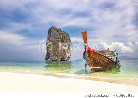 Longtail Tourist Sightseeing Boat on the White Sand Beach of Ko Poda Island, Krabi, Thailand Longtail Tourist Sightseeing Boat on the White Sand Beach of Ko Poda Island, Krabi, Thailand 60663955