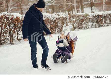 Cute family in a winter park 60666476