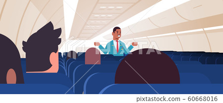 steward explaining instructions for passengers african american male flight attendant in uniform showing emergency exits safety demonstration concept airplane board interior horizontal 60668016