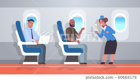 flight attendant serving alcohol drinks to passengers stewardess in uniform holding tray with champagne glass professional service travel concept airplane board interior full length horizontal 60668178