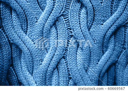 White knitted repeating pattern of handmade texture. 60669567