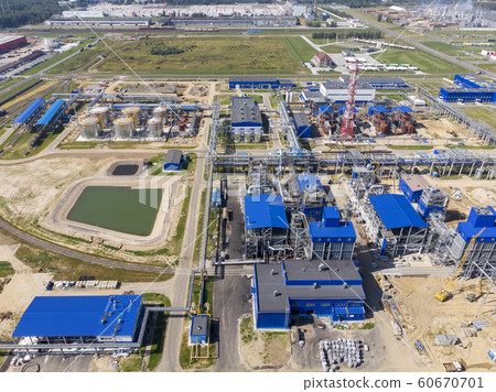 Plant for the production of liquefied natural gas. Construction of a factory for pumping liquefied gas. Aerial shooting with a drone. 60670701