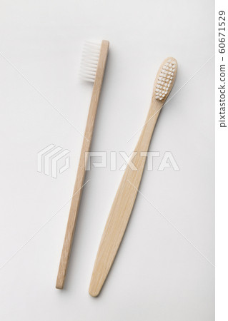 Plastic-free, organic Toothbrushes laying on white background Plastic-free, organic Toothbrushes laying on white background 60671529