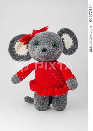 Plush mouse with a red bow on its head 60672334