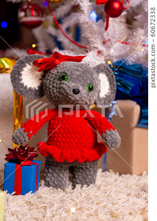 Plush toy mouse girl on New Year's background 60672338