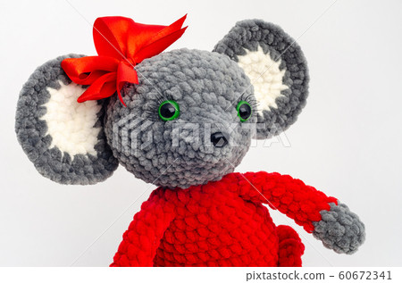Portrait of a teddy mouse with a red bow on its 60672341