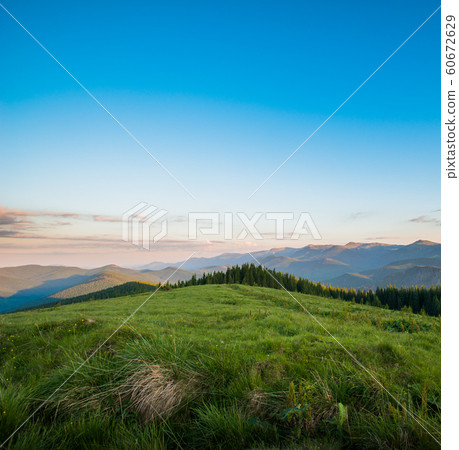 Blue sky and green hills. Blue sky and green hills. 60672629