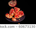 Pomegranate with Christmas decorations on dark 60673130