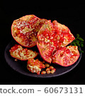 Pomegranate with Christmas decorations on dark 60673131
