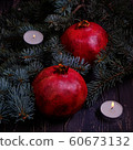 Pomegranate with Christmas decorations on dark 60673132