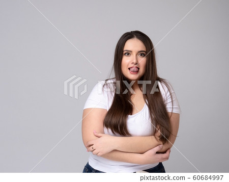 Smiling Plus Size attractive Woman dreaming. 60684997