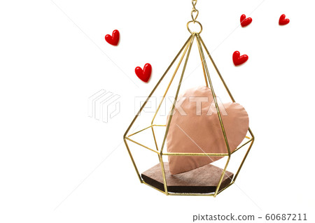 A pink heart and a small red heart in a gold basket go flying 60687211