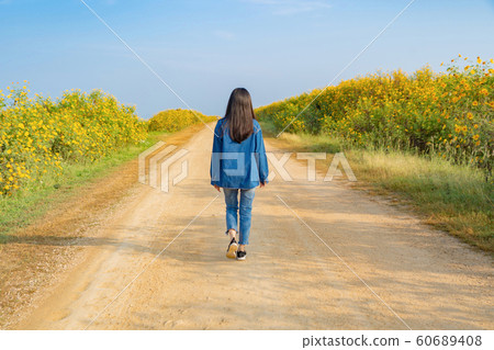 Portrait of happy Asian woman enjoying and 60689408