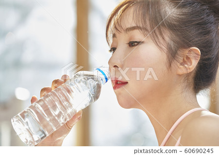 Young woman, morning, exercise, health, diet, sports, water, bottle, living room, room, house Young woman, morning, exercise, health, diet, sports, water, bottle, living room, room, house 60690245