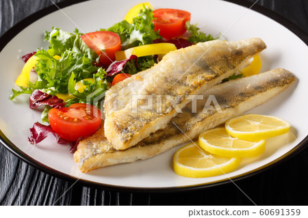 Tasty fried zander fillet with fresh vegetable Tasty fried zander fillet with fresh vegetable 60691359