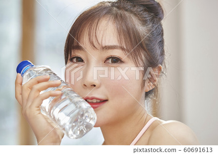 Young woman, morning, exercise, health, diet, sports, water, bottle, living room, room, house 60691613