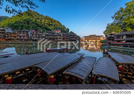 Old historic wooden tourist boats in Fenghuang 60695000