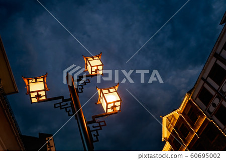 Brightly lit lamppost on the street in Wulingyuan 60695002