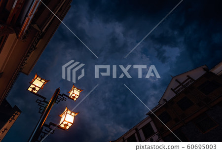 Brightly lit lamppost on the street in Wulingyuan 60695003