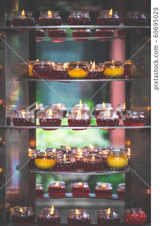 Fire burning in the memorial candles Fire burning in the memorial candles 60695029