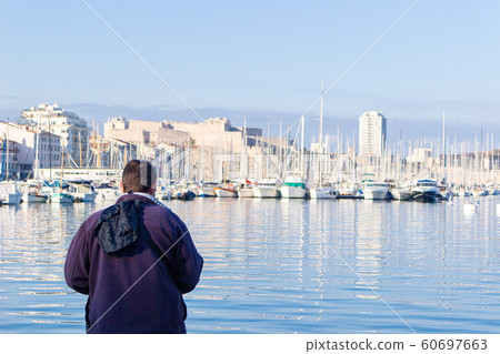 Marseille harbor and fisherman 60697663