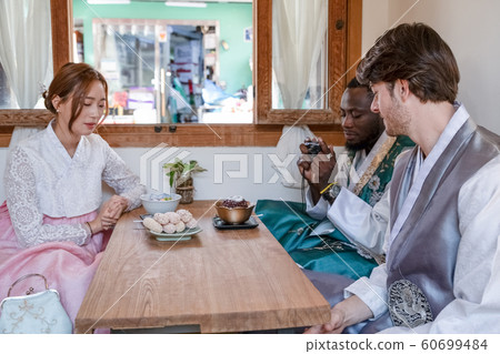 Holidays and tourism concept, group of smiling friends traveling in Seoul, Korea 391 60699484