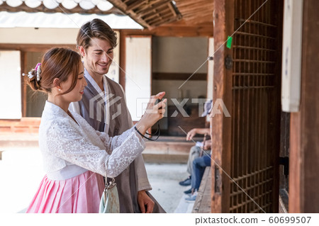 Holidays and tourism concept, group of smiling friends traveling in Seoul, Korea 346 60699507