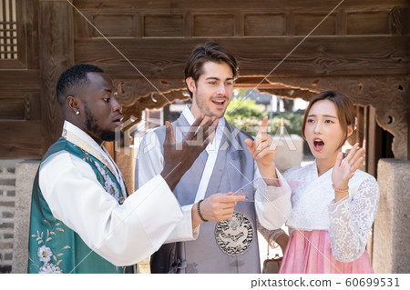 Holidays and tourism concept, group of smiling friends traveling in Seoul, Korea 381 60699531