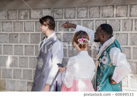 Holidays and tourism concept, group of smiling friends traveling in Seoul, Korea 298 60699533