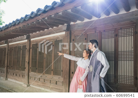 Holidays and tourism concept, group of smiling friends traveling in Seoul, Korea 390 Holidays and tourism concept, group of smiling friends traveling in Seoul, Korea 390 60699541