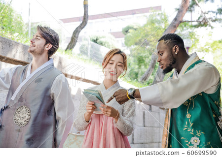 Holidays and tourism concept, group of smiling friends traveling in Seoul, Korea 328 Holidays and tourism concept, group of smiling friends traveling in Seoul, Korea 328 60699590