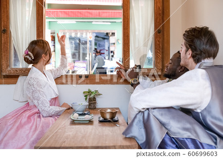 Holidays and tourism concept, group of smiling friends traveling in Seoul, Korea 402 60699603