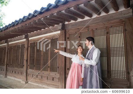 Holidays and tourism concept, group of smiling friends traveling in Seoul, Korea 400 60699610