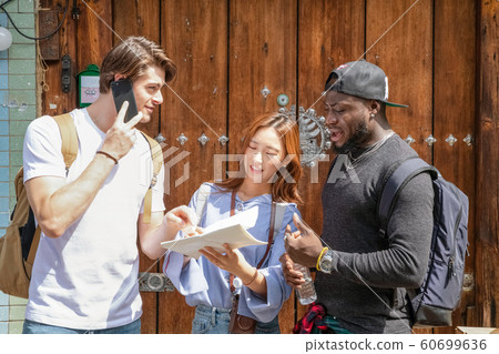 Holidays and tourism concept, group of smiling friends traveling in Seoul, Korea 271 Holidays and tourism concept, group of smiling friends traveling in Seoul, Korea 271 60699636