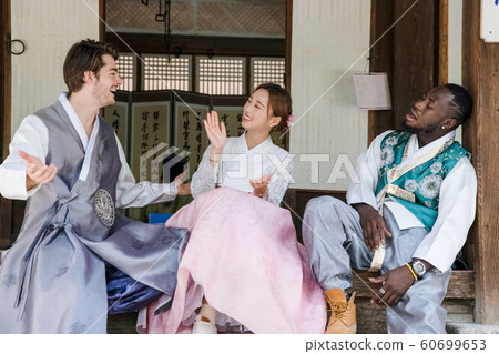 Holidays and tourism concept, group of smiling friends traveling in Seoul, Korea 261 60699653