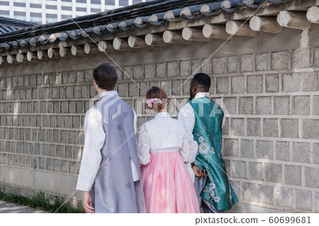 Holidays and tourism concept, group of smiling friends traveling in Seoul, Korea 230 Holidays and tourism concept, group of smiling friends traveling in Seoul, Korea 230 60699681