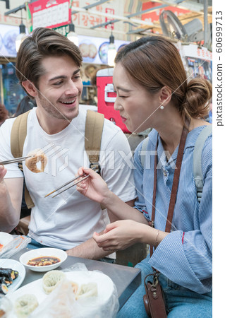 Holidays and tourism concept, group of smiling friends traveling in Seoul, Korea 137 60699713