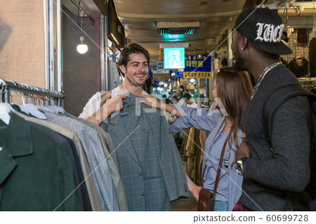 Holidays and tourism concept, group of smiling friends traveling in Seoul, Korea 186 Holidays and tourism concept, group of smiling friends traveling in Seoul, Korea 186 60699728