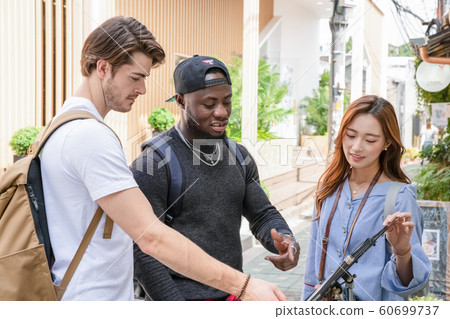 Holidays and tourism concept, group of smiling friends traveling in Seoul, Korea 264 60699737