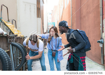 Holidays and tourism concept, group of smiling friends traveling in Seoul, Korea 182 Holidays and tourism concept, group of smiling friends traveling in Seoul, Korea 182 60699744