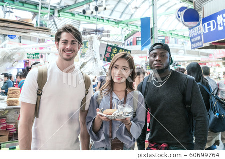 Holidays and tourism concept, group of smiling friends traveling in Seoul, Korea 148 60699764