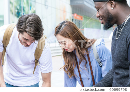 Holidays and tourism concept, group of smiling friends traveling in Seoul, Korea 096 60699798