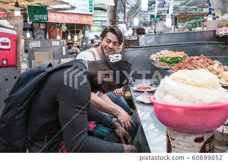 Holidays and tourism concept, group of smiling friends traveling in Seoul, Korea 098 Holidays and tourism concept, group of smiling friends traveling in Seoul, Korea 098 60699852