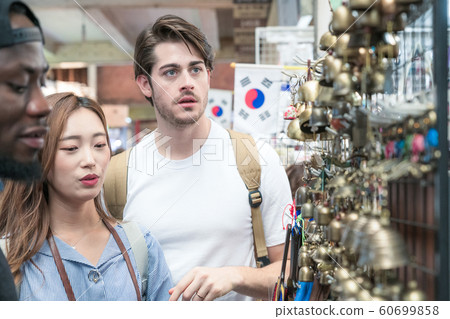 Holidays and tourism concept, group of smiling friends traveling in Seoul, Korea 162 Holidays and tourism concept, group of smiling friends traveling in Seoul, Korea 162 60699858