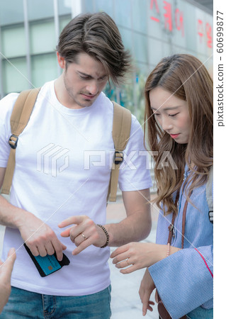 Holidays and tourism concept, group of smiling friends traveling in Seoul, Korea 136 Holidays and tourism concept, group of smiling friends traveling in Seoul, Korea 136 60699877