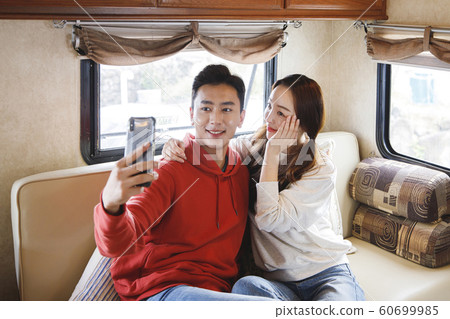 Happy young couple, camping or trip in Jeju, Korea 170 Happy young couple, camping or trip in Jeju, Korea 170 60699985